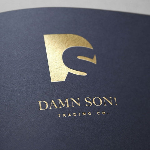 Award-winning brand identity for DAMN SON international trading company featuring bold typography and premium positioning representing SirCharles.DESIGN's expertise in global business branding