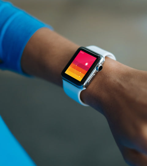 Premium Apple Watch health interface with gradient vital signs display representing SirCharles.DESIGN's expertise in wearable technology and medical device user experience optimization