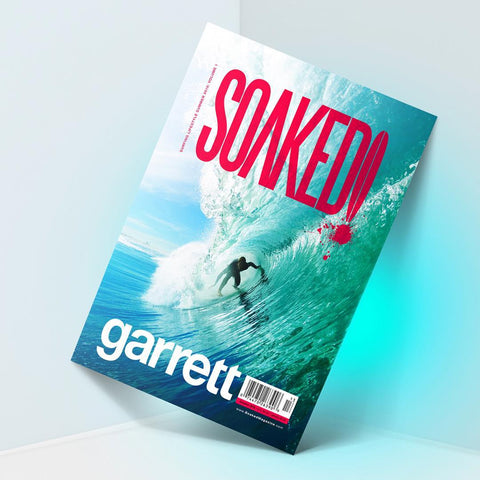 Award-winning SOAKED! magazine cover design featuring dynamic surf photography and bold typography representing SirCharles.DESIGN's excellence in lifestyle publication design and action sports editorial branding