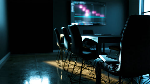 Design leadership cadence workspace with laptop, notebook, and product strategy materials.