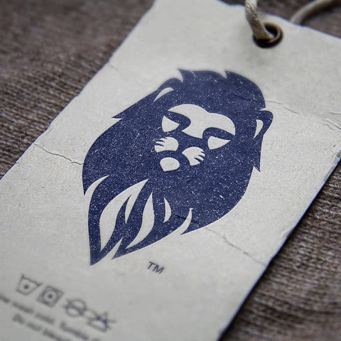 Professional hang tag featuring LEO Denim & Jeans' distinctive blue lion head logo, showcasing SirCharles.DESIGN's Gold award-winning branding and Design of the Year nomination from INDIGO Design Awards 2018
